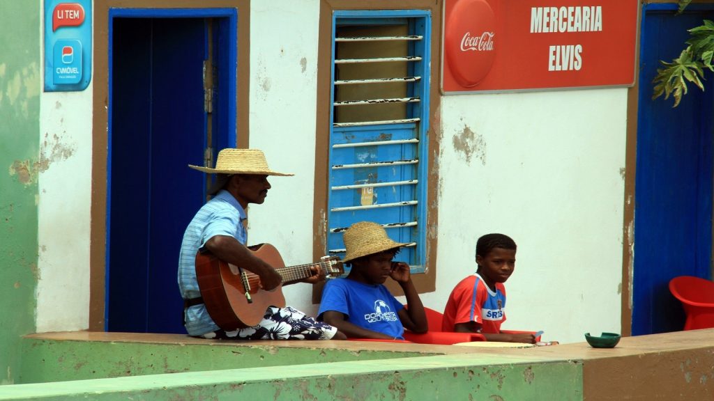 No stress, just playing some music in front of a small shop called Elvis