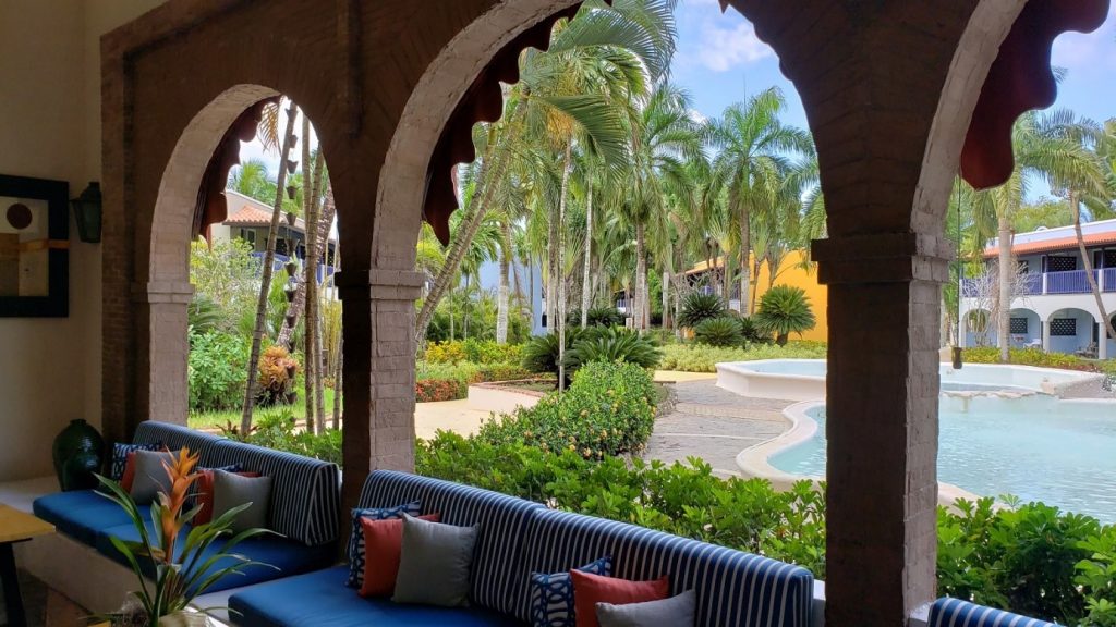 A the lobby and part of the garden of a hotel