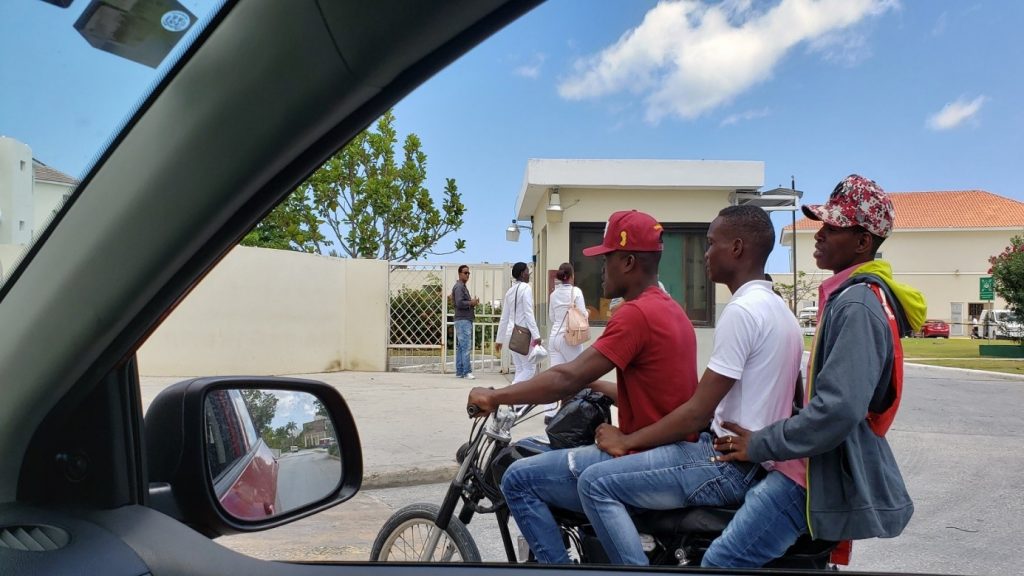 1 motorbike, 3 guys, no helmet just baseball caps. This is how you can see them on the highways too