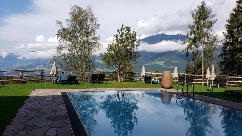 Hotel pool with the view of  South Tyrolean mountains